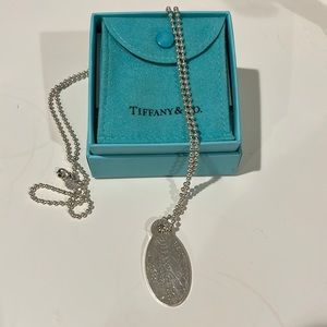 Return to Tiffany & Co. Sterling Silver pendant and chain.